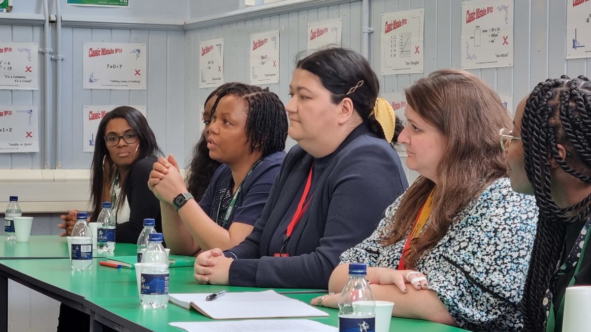 Staff at a school participating in SWIS talk to education minister Nadhim Zahawi